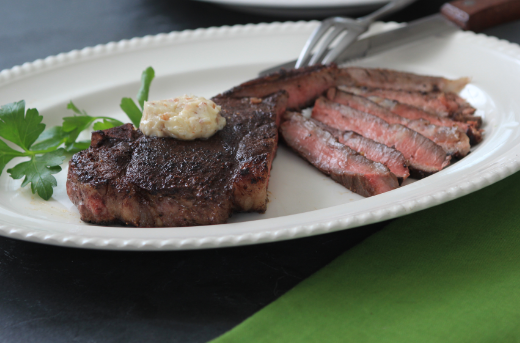 Cocoa and Black Pepper Crusted New York Strip Steaks with Bacon Butter