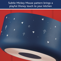 Subtle Mickey Mouse pattern brings a playful Disney touch to your kitchen: close-up of the blue saucepan exterior with white Mickey heads and sparkles