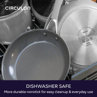Dishwasher safe, more durable nonstick for easy cleanup and everyday use: gray Circulon frying pan and pots loaded in a dishwasher