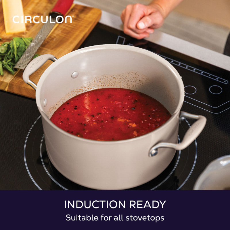 Induction ready, suitable for all stovetops: taupe stockpot of tomato sauce on an induction cooktop