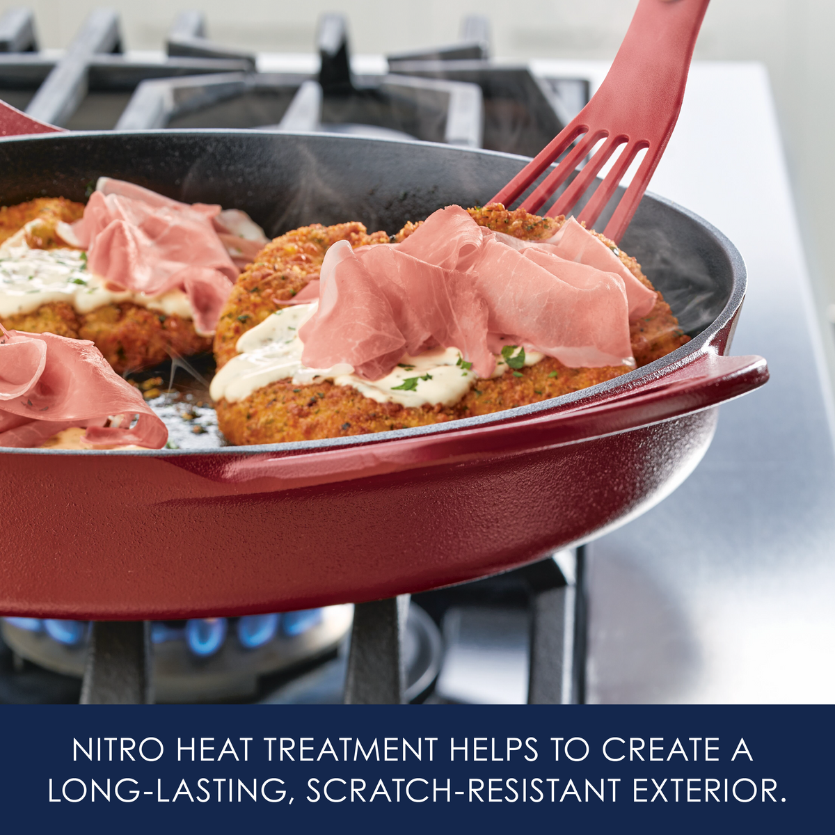 Nitro heat treatment helps to create a long-lasting, scratch-resistant exterior: red cast iron skillet of breaded cutlets topped with prosciutto on a gas burner