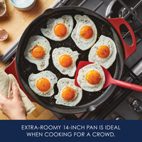 Extra-roomy 14-inch pan is ideal when cooking for a crowd: overhead view of eight fried eggs in a red cast iron skillet with side handles
