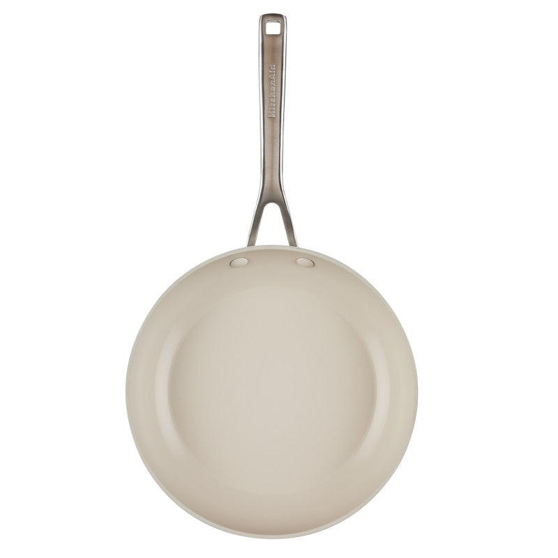 Top view of the porcelain white frying pan's ceramic nonstick interior and stainless steel handle