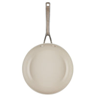 Top view of the porcelain white frying pan's ceramic nonstick interior and stainless steel handle