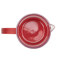Top view into the empty red French press carafe, with the spout and handle