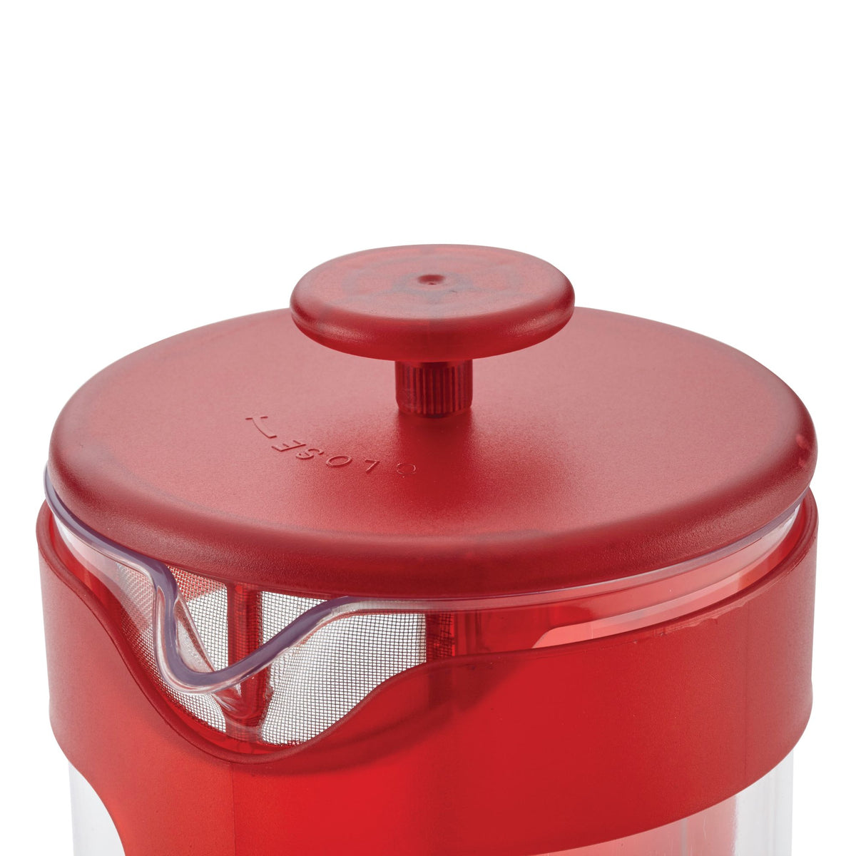 Close-up of the red French press lid and knob above the pour spout, with the mesh filter visible