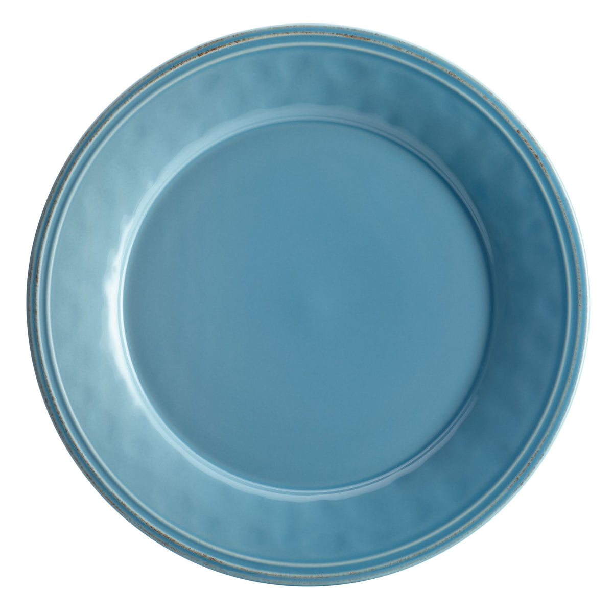 Top view of an agave blue plate with a rippled rim and speckled edge