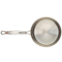 Top view of the copper saucepan's stainless steel interior and long stainless steel handle