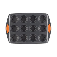 Top view of the gray 12-cup muffin pan with orange handles