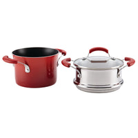 Red saucepot with black nonstick interior beside the covered stainless steel steamer insert