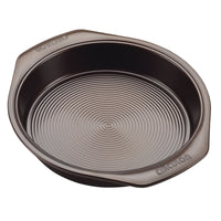 Chocolate round cake pan with concentric circles on the base and Circulon on the handles