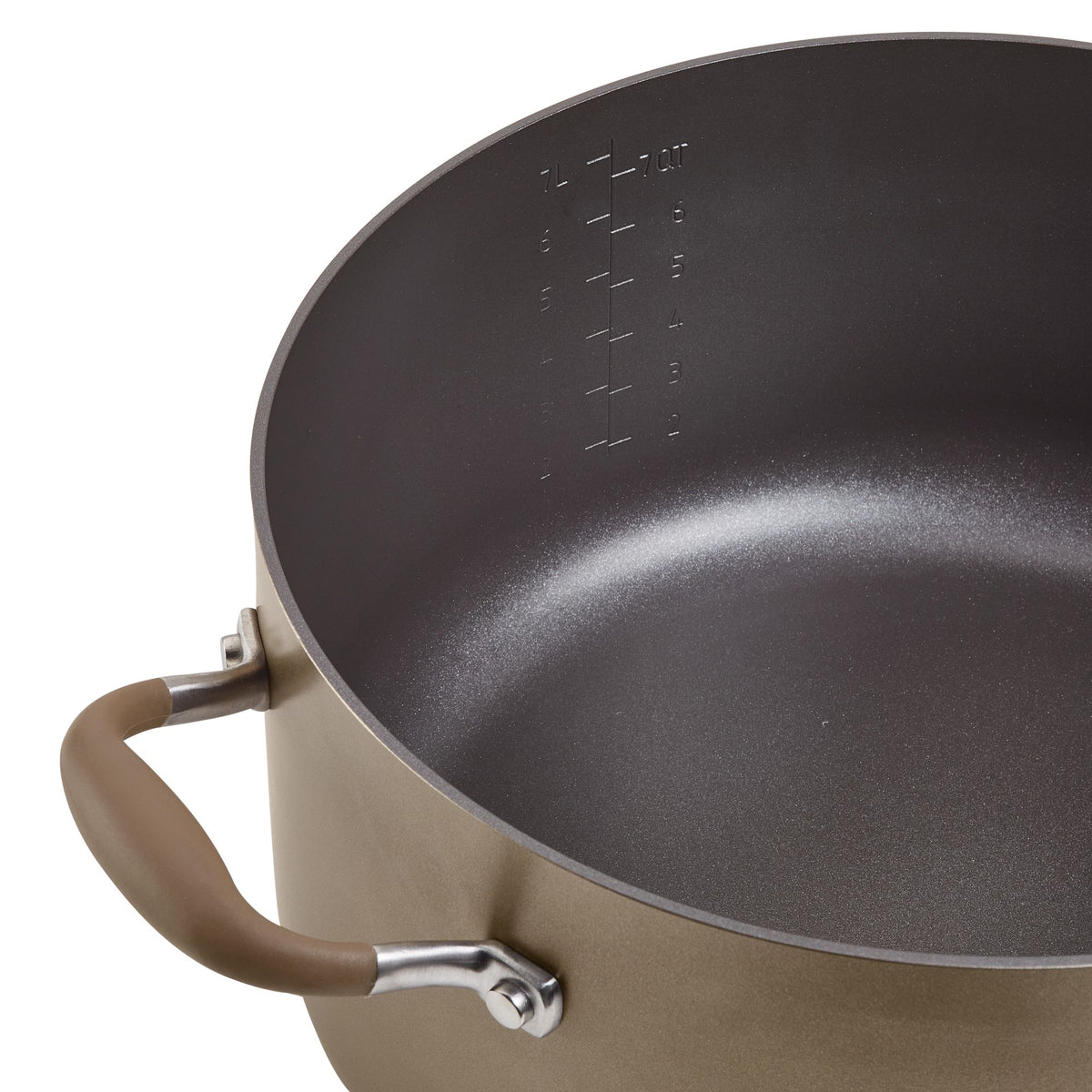 Close-up of the bronze stockpot interior with etched quart and liter measurement markings